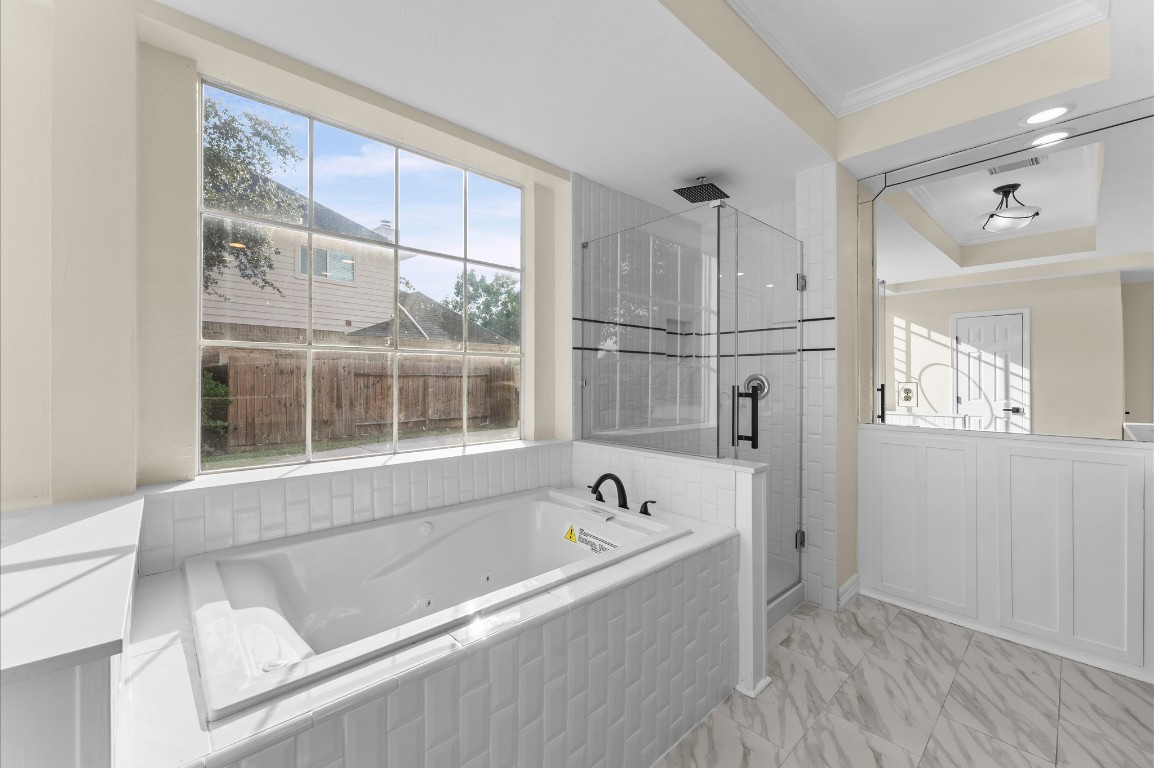 6330 Borg Breakpoint Drive Spring, TX 77379 - Photo 23 of 49 a bathroom with a bathtub and a shower