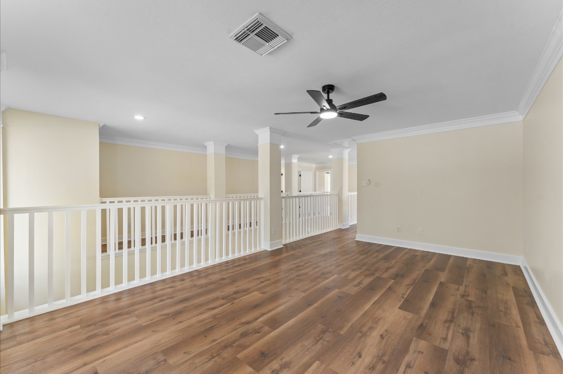 6330 Borg Breakpoint Drive Spring, TX 77379 - Photo 27 of 49 a view of a room with wooden floor and a ceiling fan