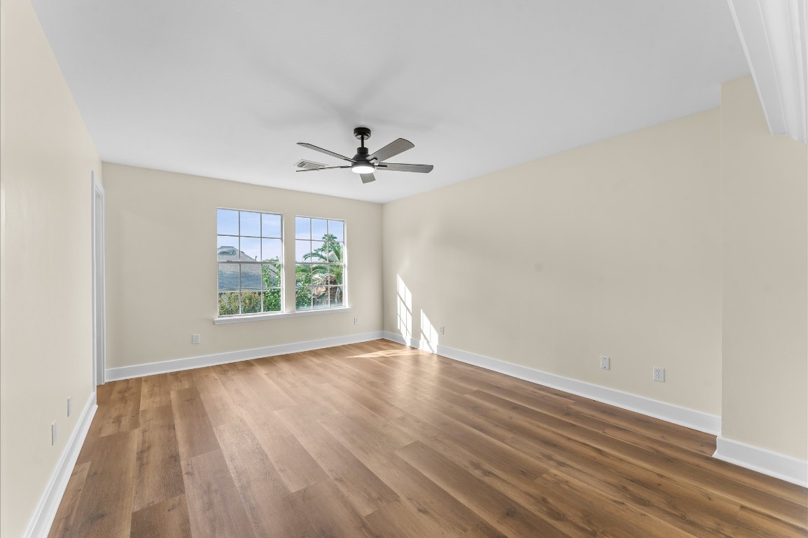 6330 Borg Breakpoint Drive Spring, TX 77379 - Photo 28 of 49 wooden floor in an empty room with a window