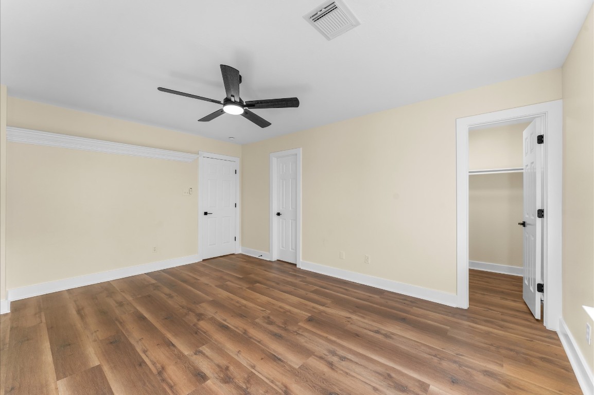 6330 Borg Breakpoint Drive Spring, TX 77379 - Photo 29 of 49 a view of a livingroom with a ceiling fan and wooden floor
