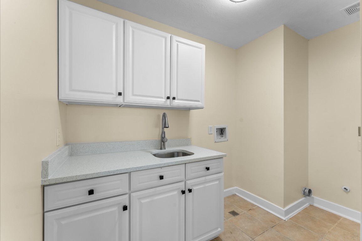 6330 Borg Breakpoint Drive Spring, TX 77379 - Photo 30 of 49 a kitchen with a sink and cabinets