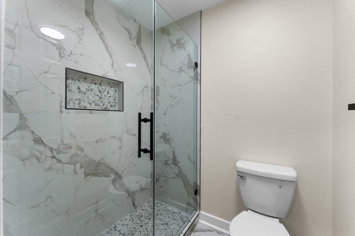 6330 Borg Breakpoint Drive Spring, TX 77379 - Photo 33 of 49 a bathroom with a toilet and a shower
