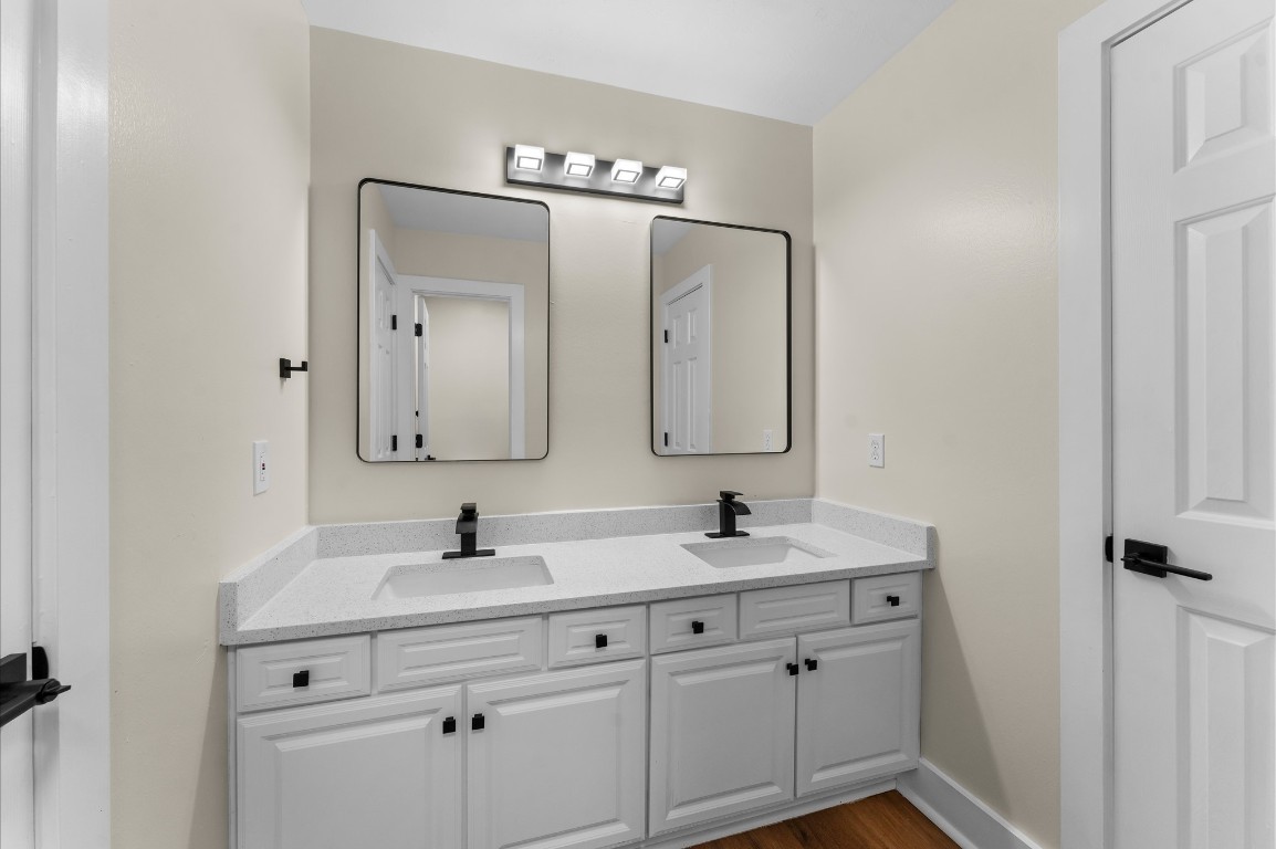 6330 Borg Breakpoint Drive Spring, TX 77379 - Photo 34 of 49 a bathroom with a double vanity sink and mirror