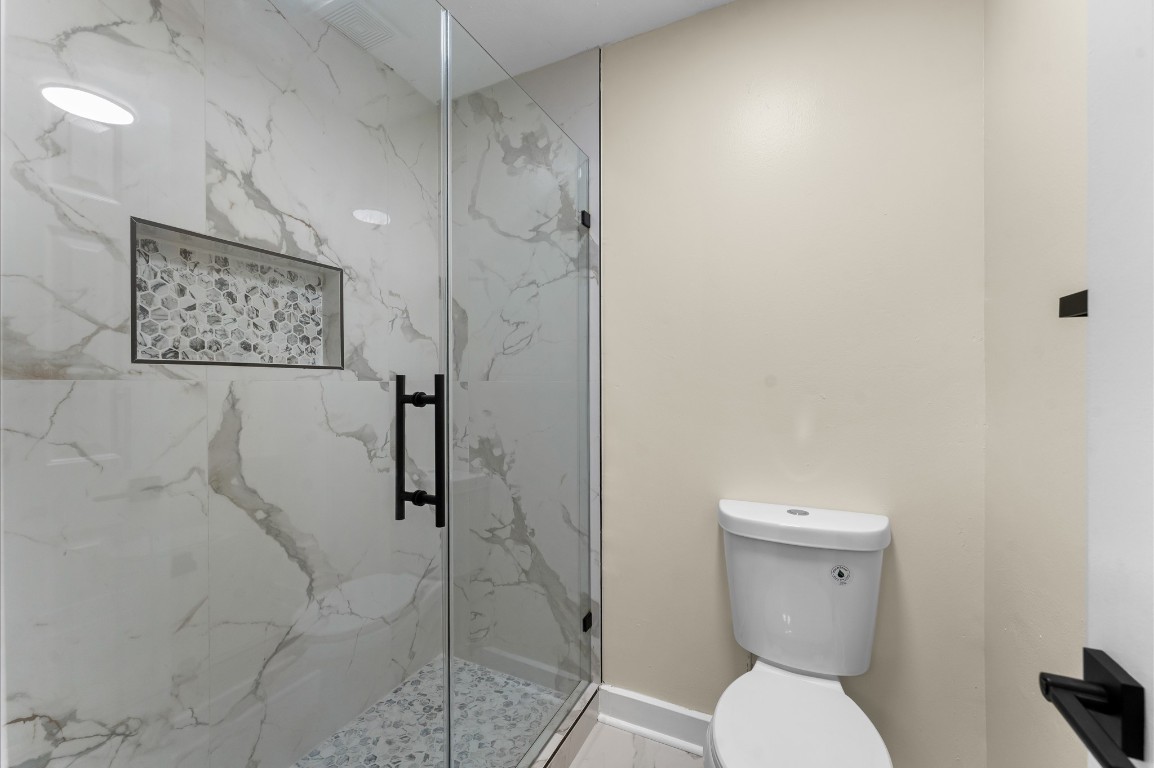 6330 Borg Breakpoint Drive Spring, TX 77379 - Photo 37 of 49 a bathroom with a toilet and a shower