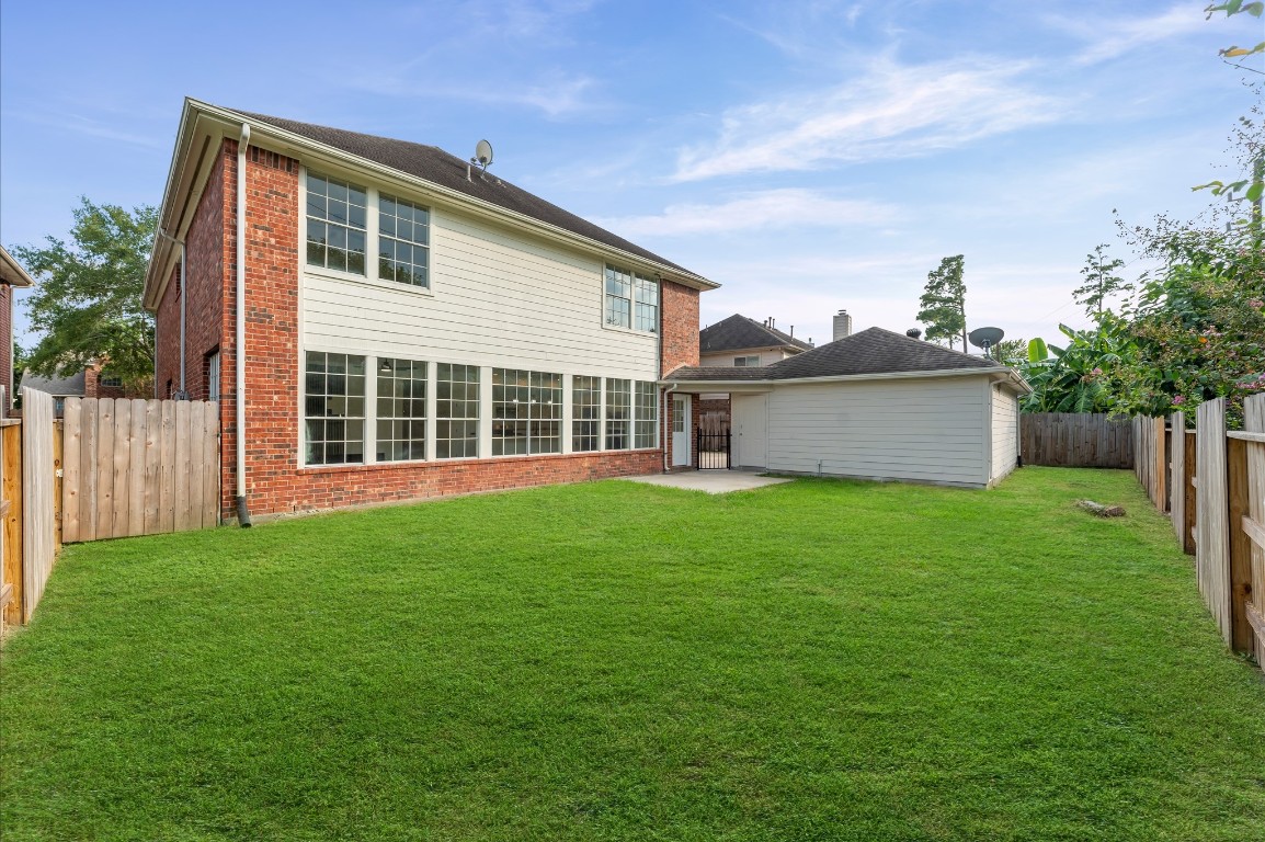 6330 Borg Breakpoint Drive Spring, TX 77379 - Photo 41 of 49 a view of a backyard with a garden