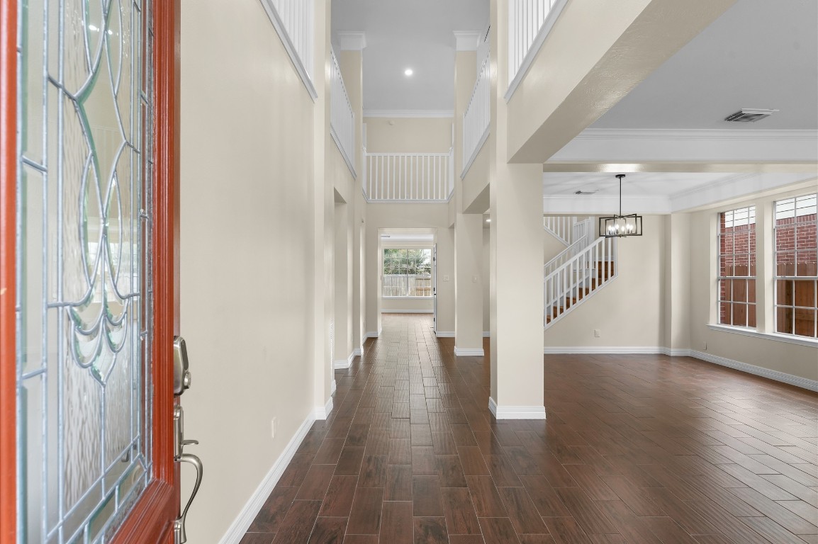 6330 Borg Breakpoint Drive Spring, TX 77379 - Photo 5 of 49 a view of a hallway with wooden floor and stairs