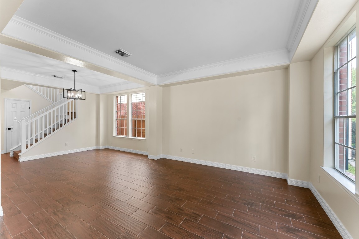 6330 Borg Breakpoint Drive Spring, TX 77379 - Photo 7 of 49 a view of an empty room with wooden floor and a window