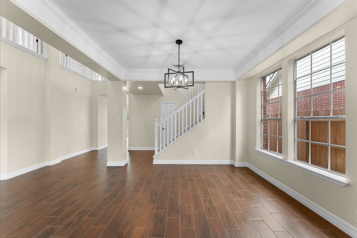 6330 Borg Breakpoint Drive Spring, TX 77379 - Photo 10 of 49 a view of an empty room with wooden floor and a window