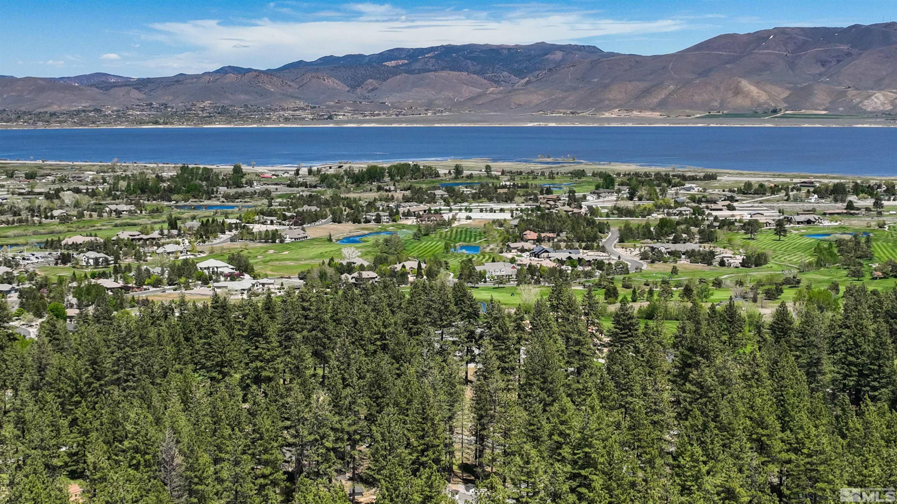 7450 Bryan Canyon Road Washoe Valley, NV 89704 - Photo 32 of 34 a view of an aerial view of residential houses with outdoor space and mountain view