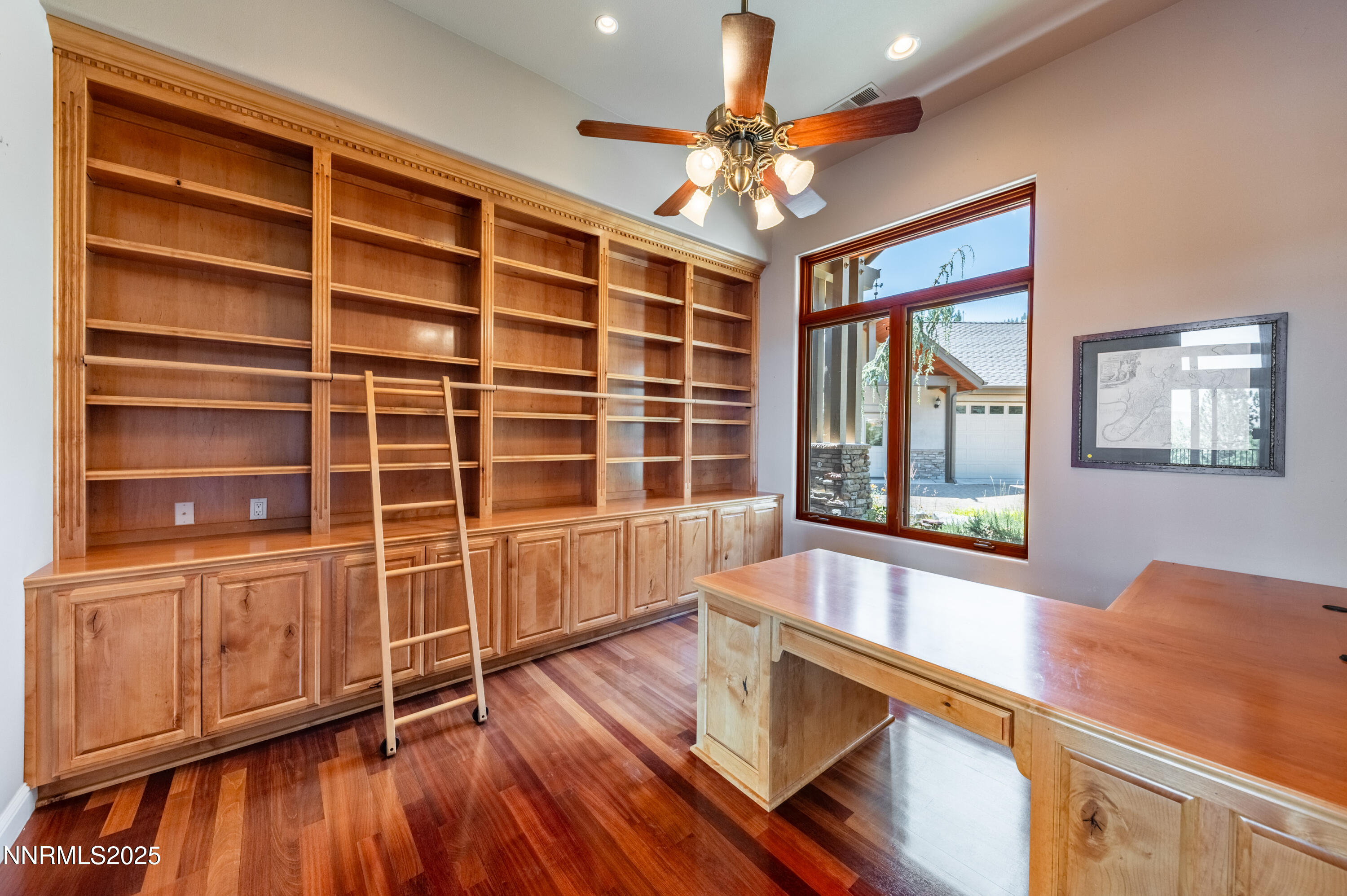 7450 Bryan Canyon Road Washoe Valley, NV 89704 - Photo 6 of 34 a view of an empty room with a window and wooden floor