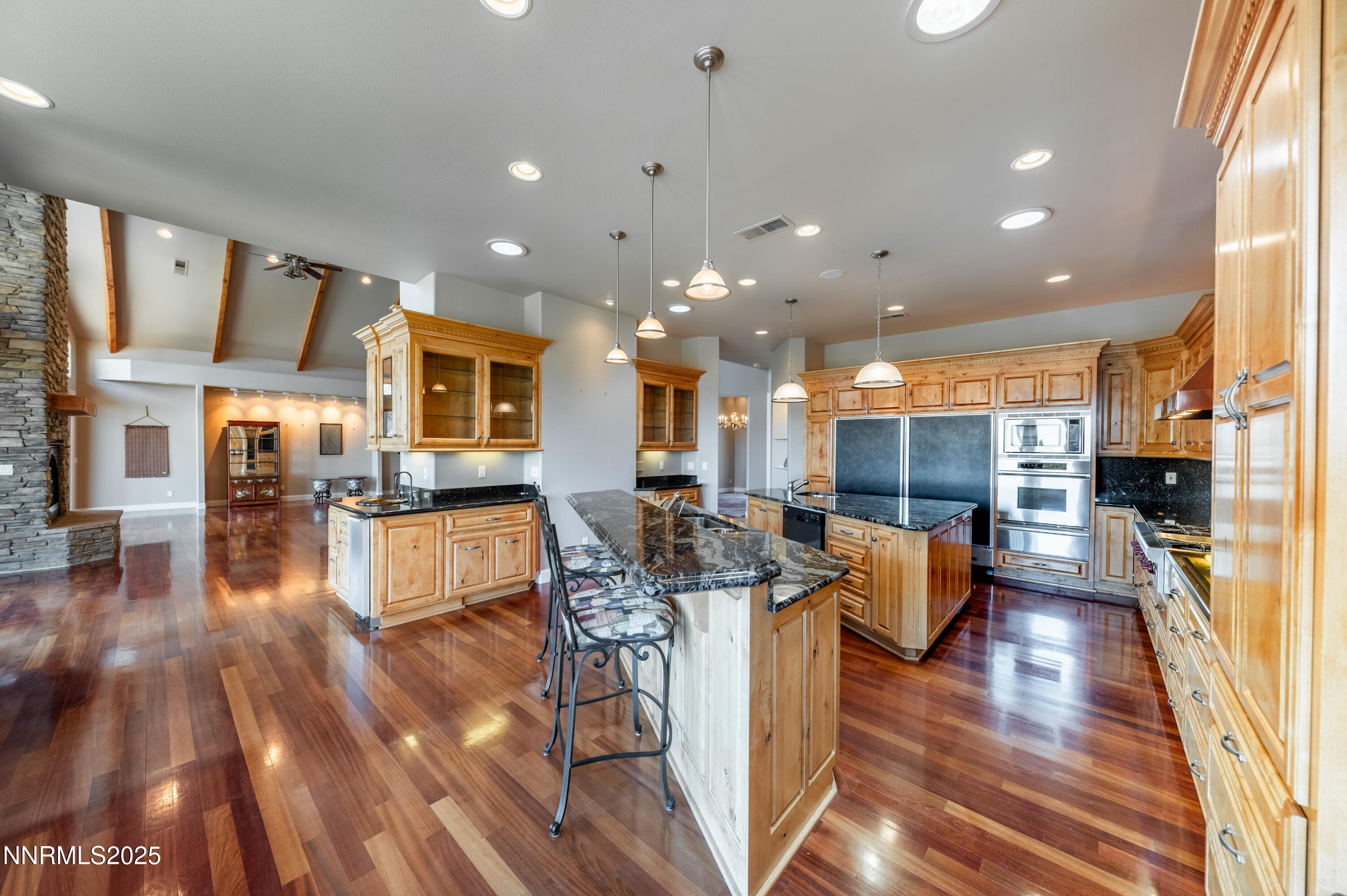 7450 Bryan Canyon Road Washoe Valley, NV 89704 - Photo 8 of 34 a living room with fireplace furniture and a wooden floor