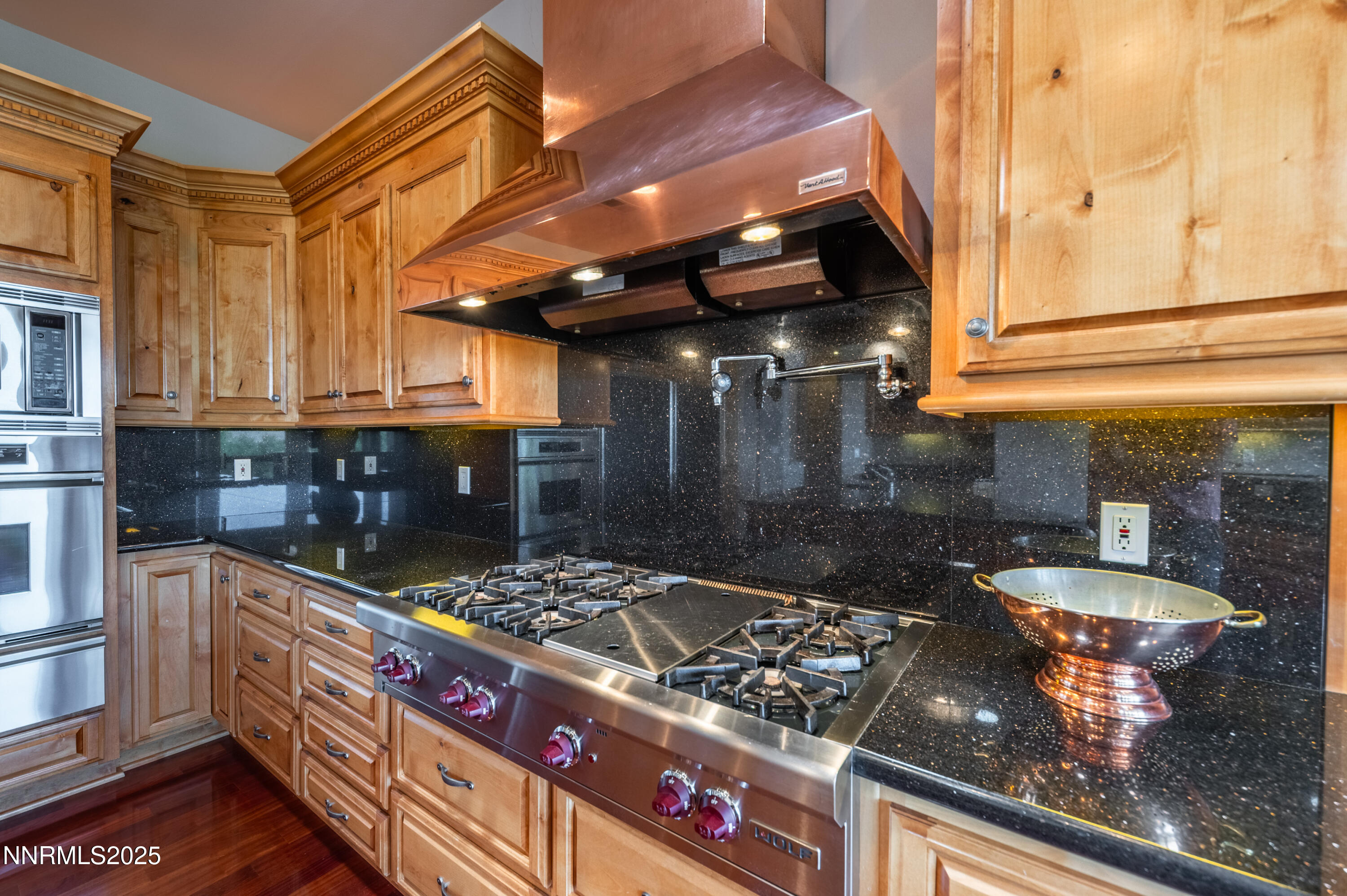 7450 Bryan Canyon Road Washoe Valley, NV 89704 - Photo 10 of 34 a kitchen with stainless steel appliances granite countertop a stove and a sink