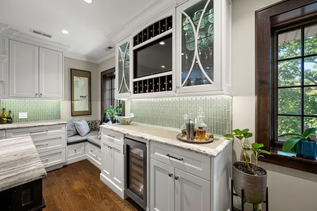 a kitchen with a refrigerator and a stove