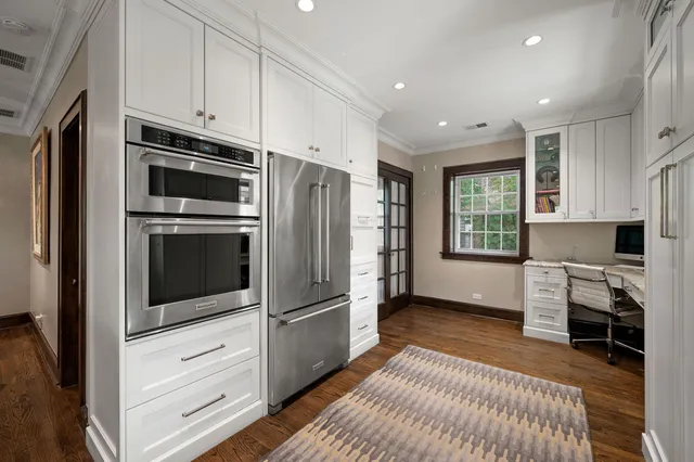 a kitchen with stainless steel appliances a refrigerator microwave and stove