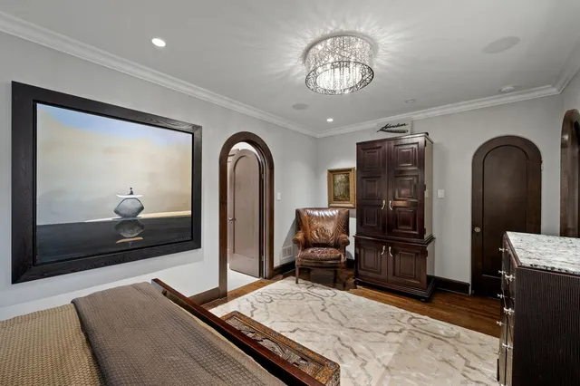 a living room with furniture rug and flat screen tv