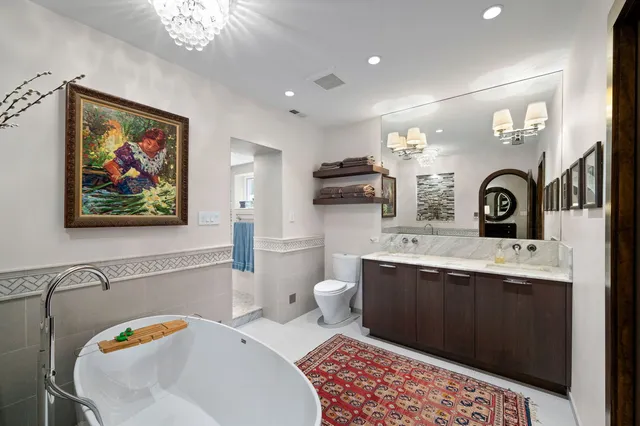a spacious bathroom with a double vanity sink and a mirror