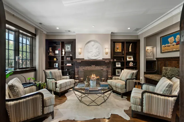a living room with furniture fireplace and a flat screen tv