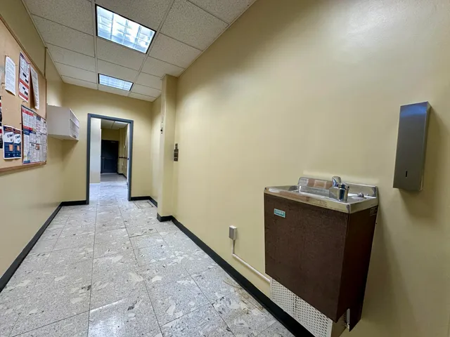 a kitchen with a sink a stove and a refrigerator