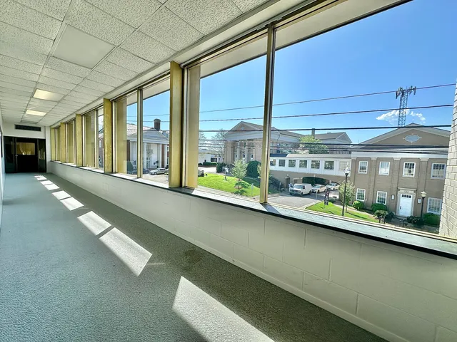 a view of a room with furniture and window