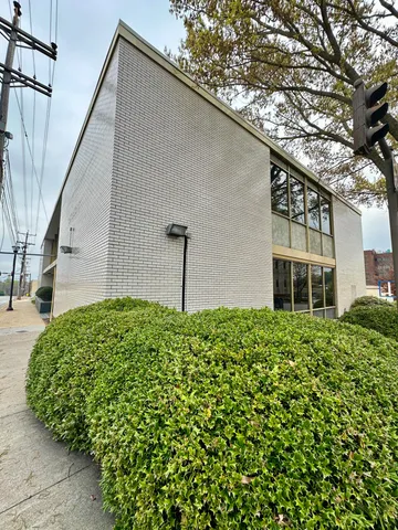 a view of a car parked in back of a house