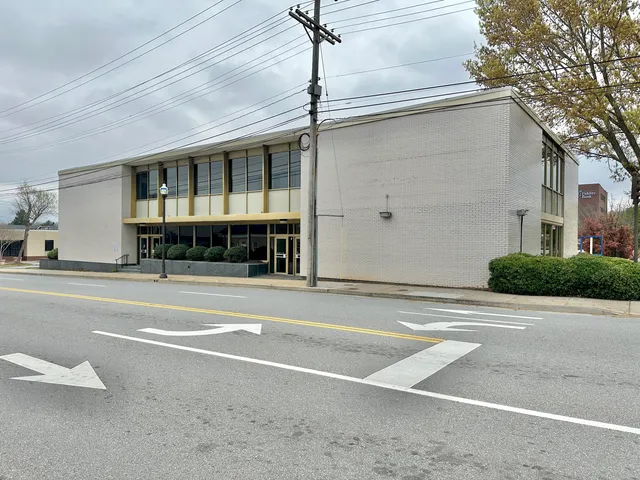 a patio with a table and chairs under an umbrella