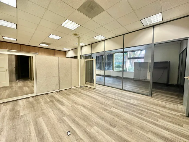 a view of an empty room with a window