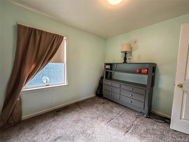 a room with window and cabinet