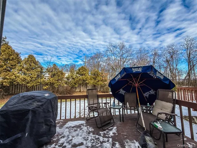 a view of a chair and table in the patio