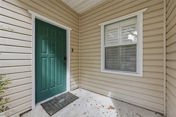 a view of a door and a window