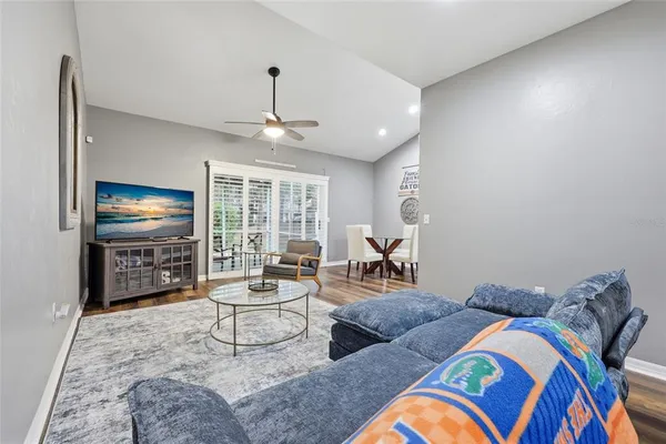a living room with furniture and a flat screen tv