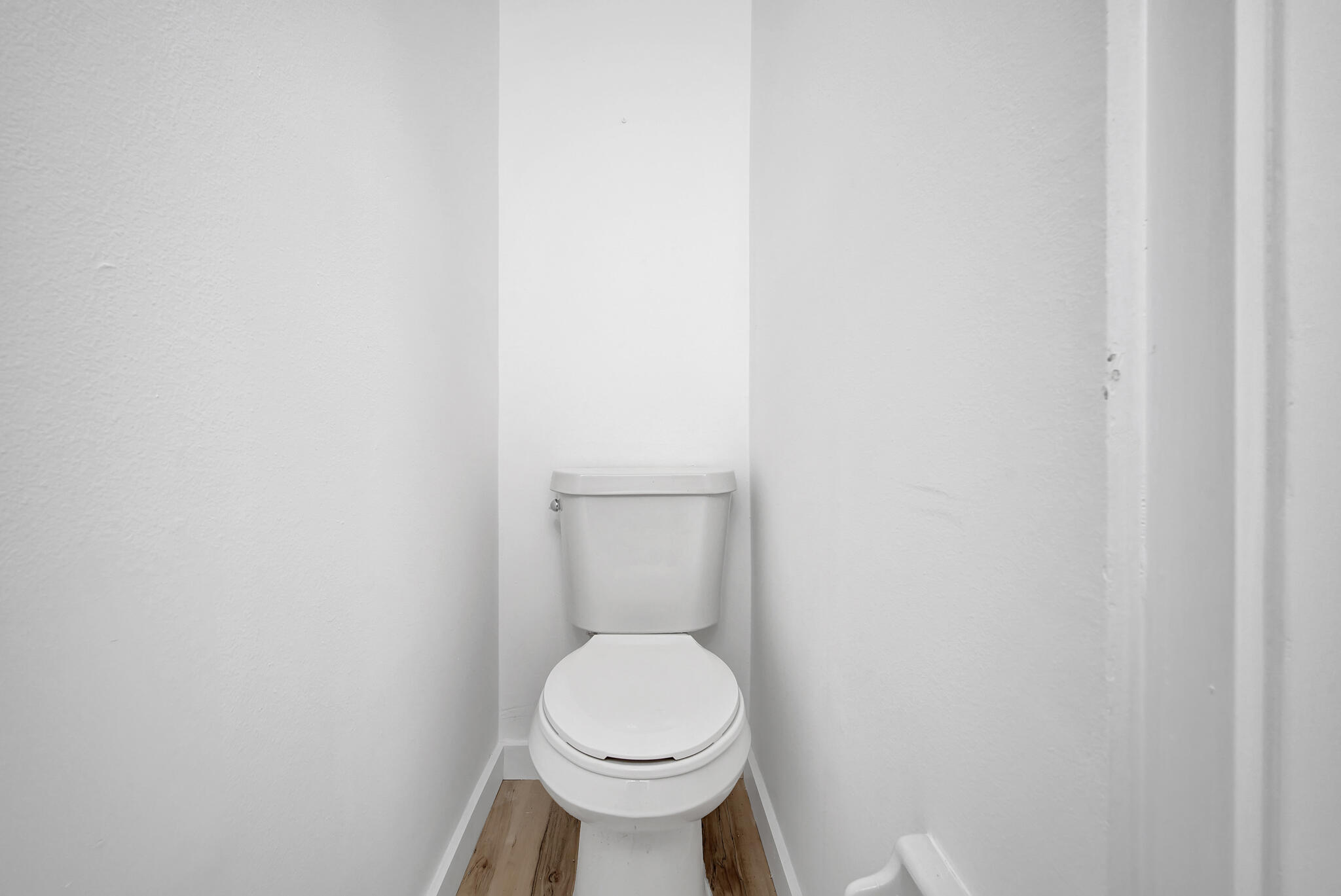 43 Summer Haven Trail, Unit 2 Miramar Beach, FL 32550 - Photo 11 of 22 a white toilet sitting next to a white wall