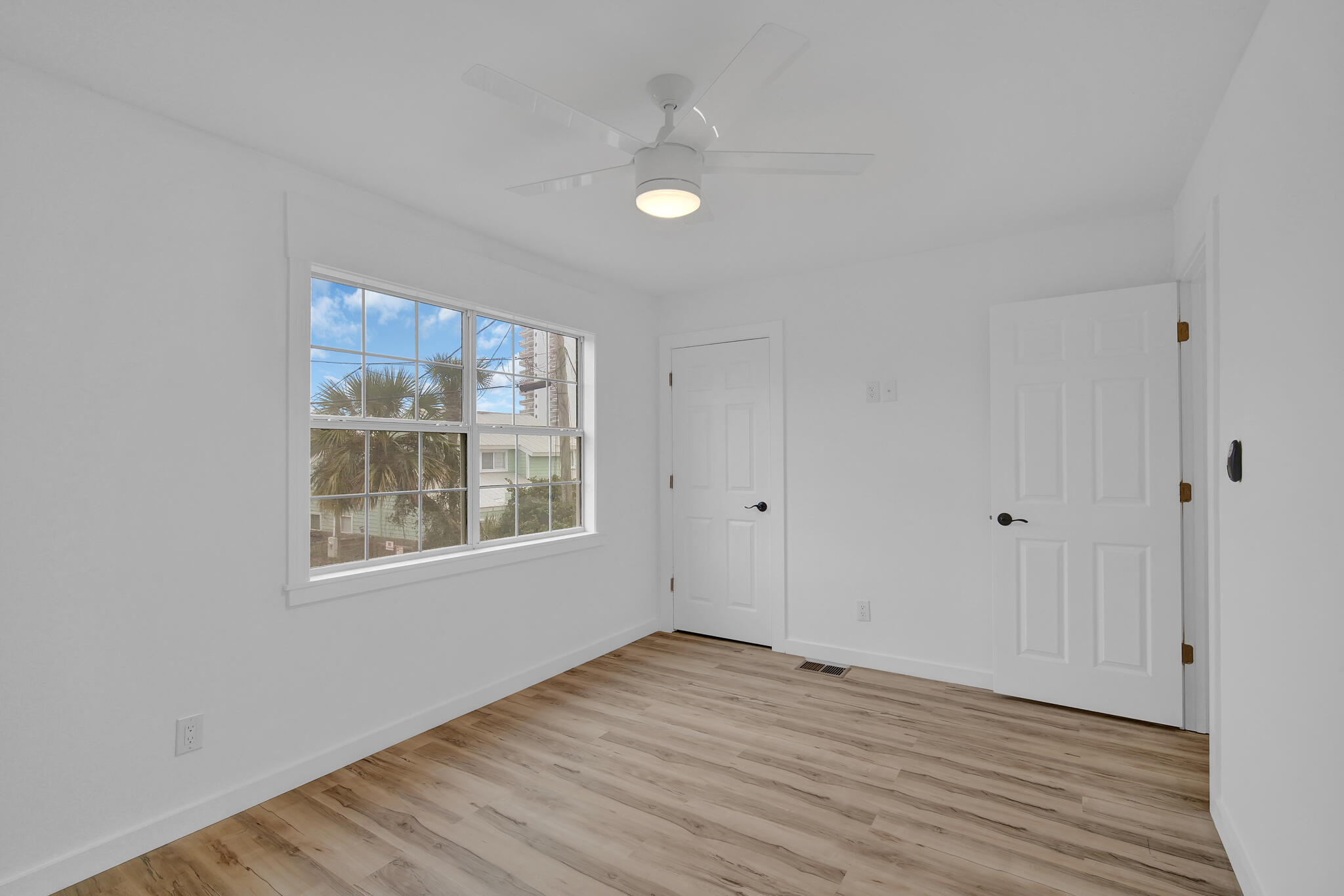 43 Summer Haven Trail, Unit 2 Miramar Beach, FL 32550 - Photo 18 of 22 a view of an empty room with wooden floor and a window