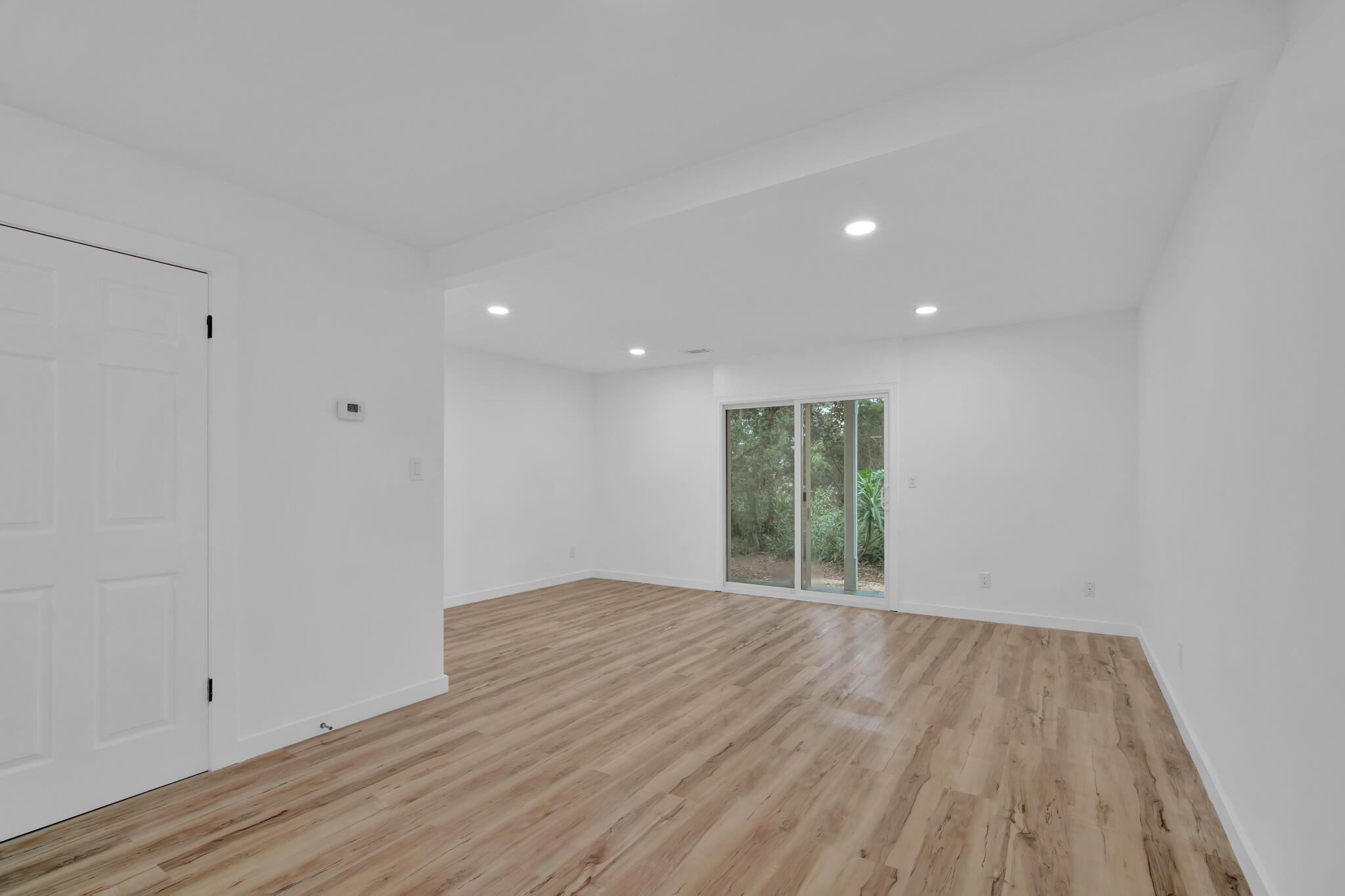 43 Summer Haven Trail, Unit 2 Miramar Beach, FL 32550 - Photo 2 of 22 a view of an empty room with wooden floor and a window