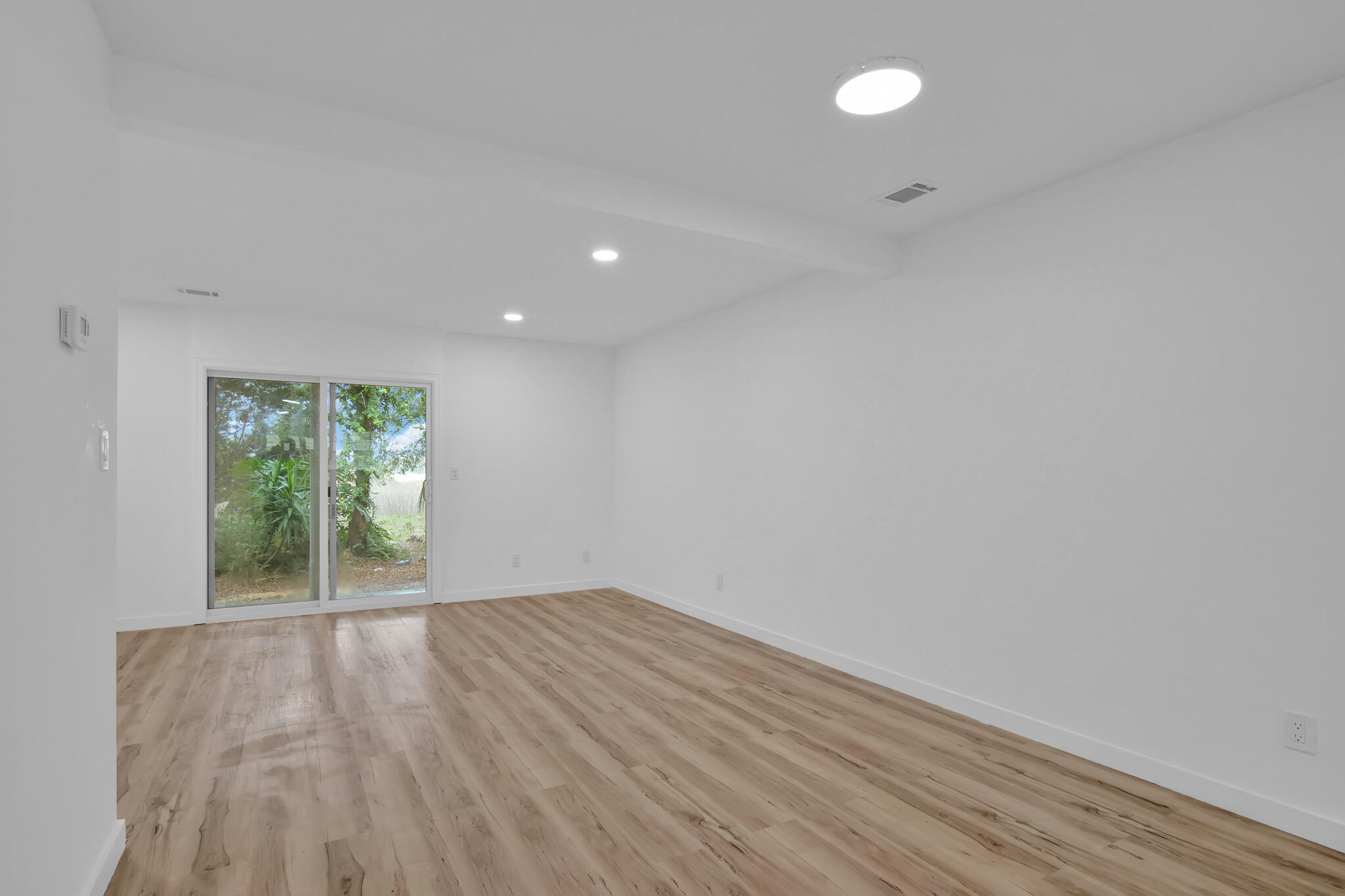 43 Summer Haven Trail, Unit 2 Miramar Beach, FL 32550 - Photo 3 of 22 a view of an empty room with wooden floor and a window