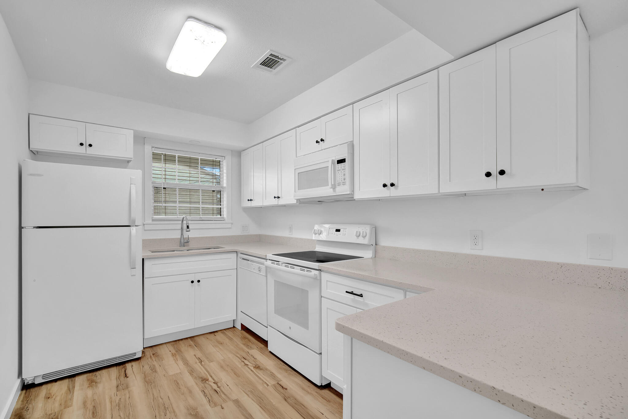 43 Summer Haven Trail, Unit 2 Miramar Beach, FL 32550 - Photo 6 of 22 a kitchen with stainless steel appliances granite countertop refrigerator sink and cabinets