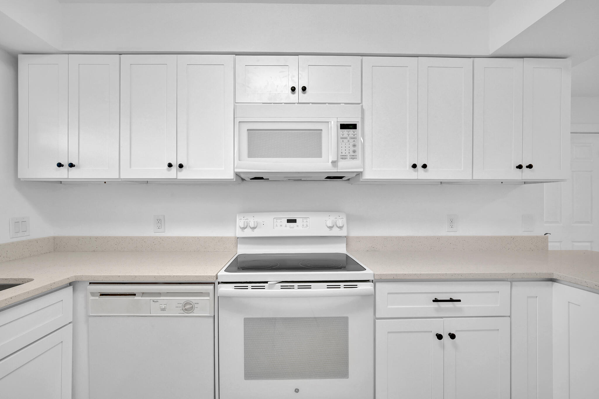 43 Summer Haven Trail, Unit 2 Miramar Beach, FL 32550 - Photo 7 of 22 a kitchen with white cabinets and white appliances