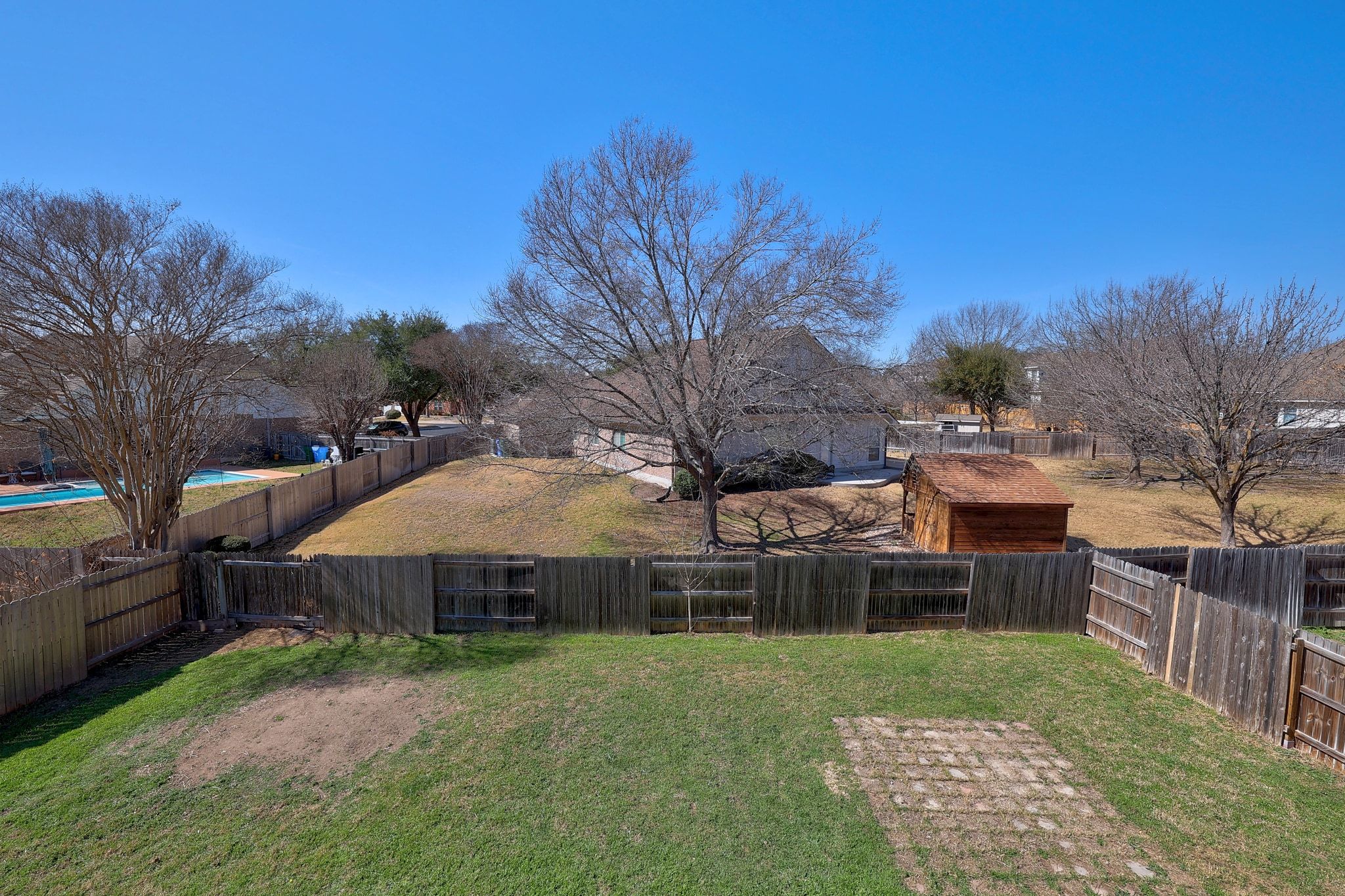 2307 Hayfield Square Pflugerville, TX 78660 - Photo 37 of 40 a view of a house with backyard and sitting area