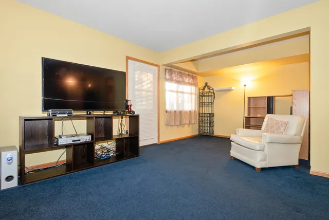 a view of a room with workspace and windows