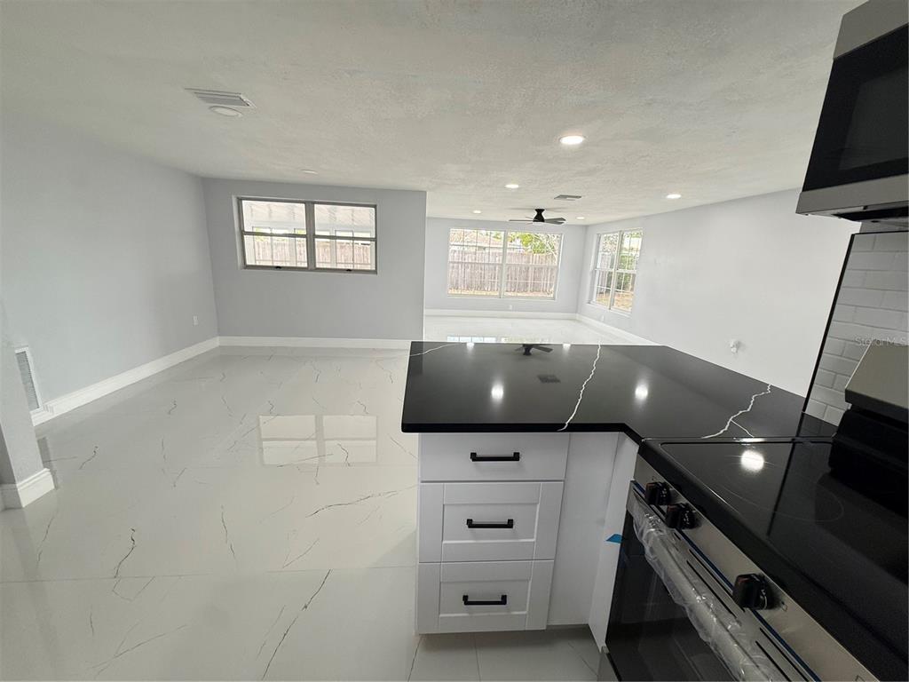 10433 Laburnum Drive Port Richey, FL 34668 - Photo 21 of 26 a view of an empty room and a window