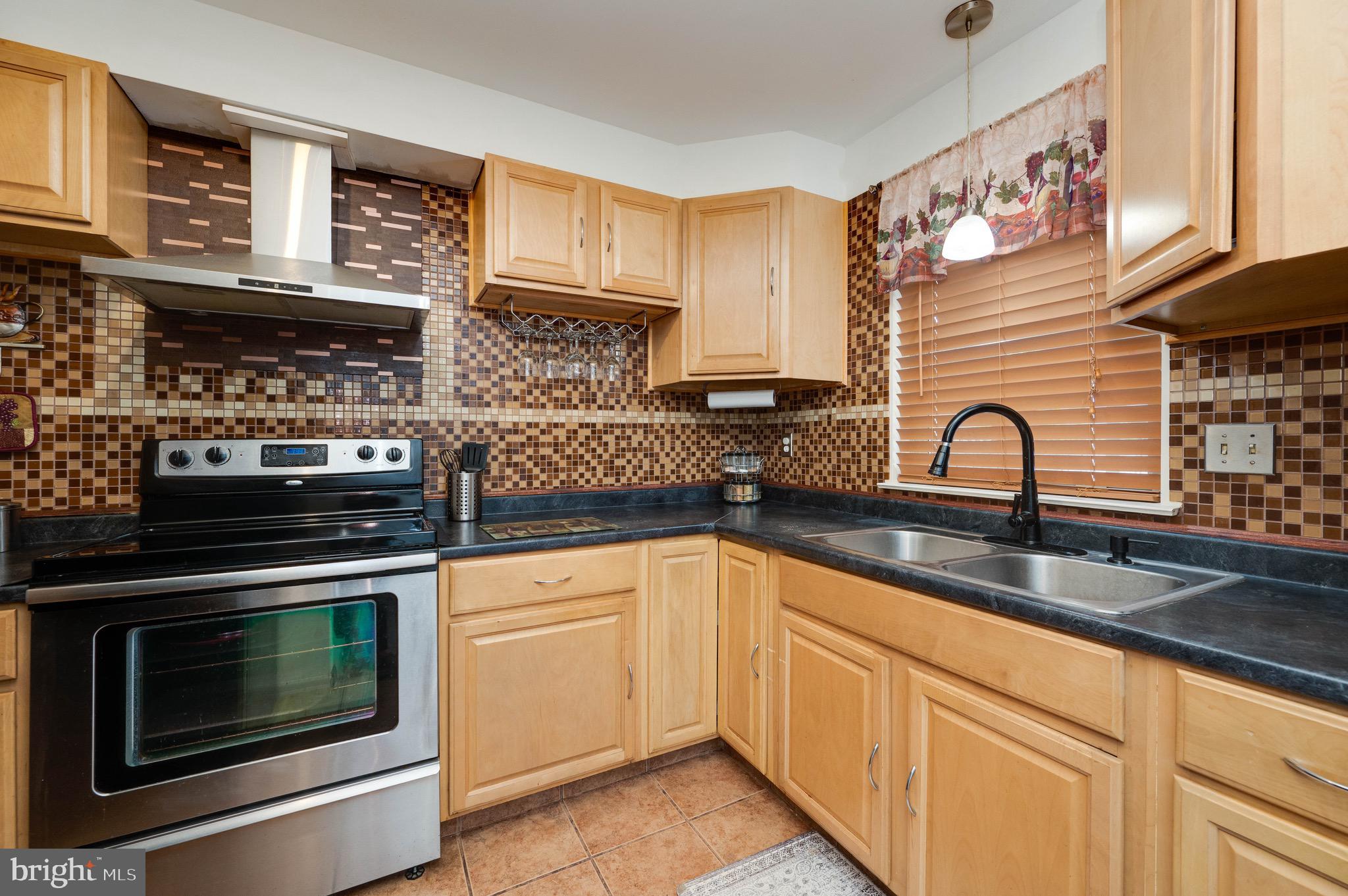 11 Nottingham Court Reading, PA 19601 - Photo 9 of 29 a kitchen with stainless steel appliances granite countertop a stove and a sink