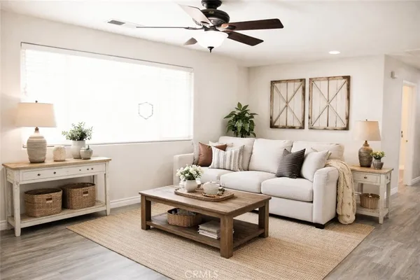 a living room with furniture and a fireplace