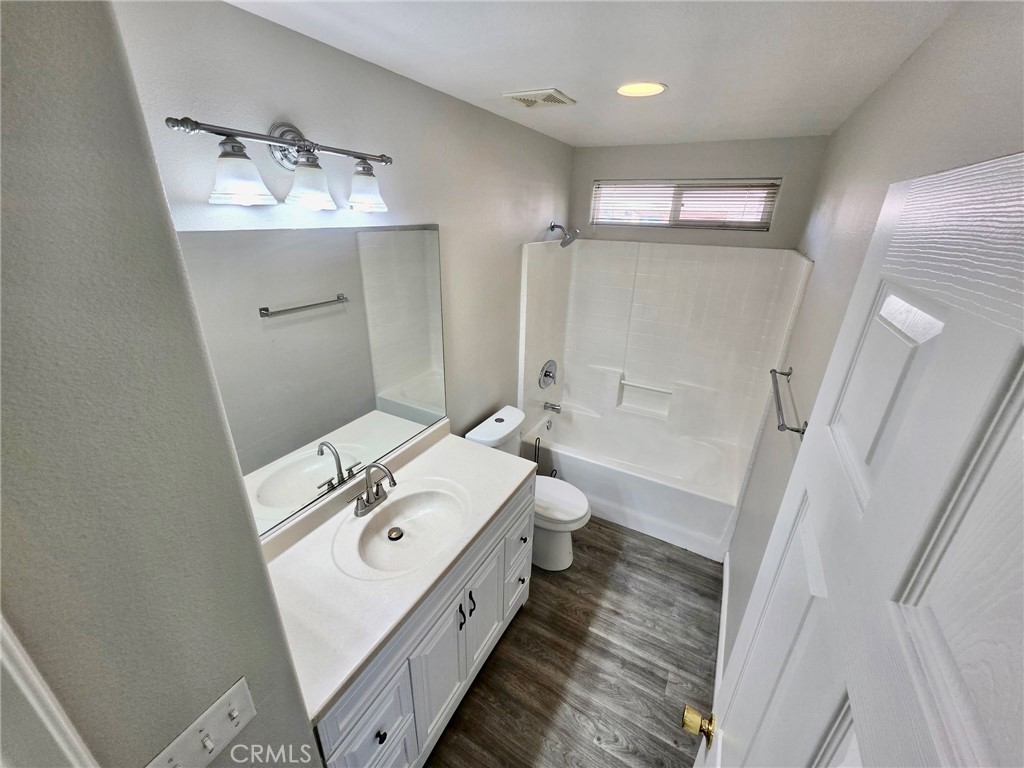 15354 Kiamichi Road Apple Valley, CA 92307 - Photo 15 of 22 a bathroom with a sink a toilet and shower