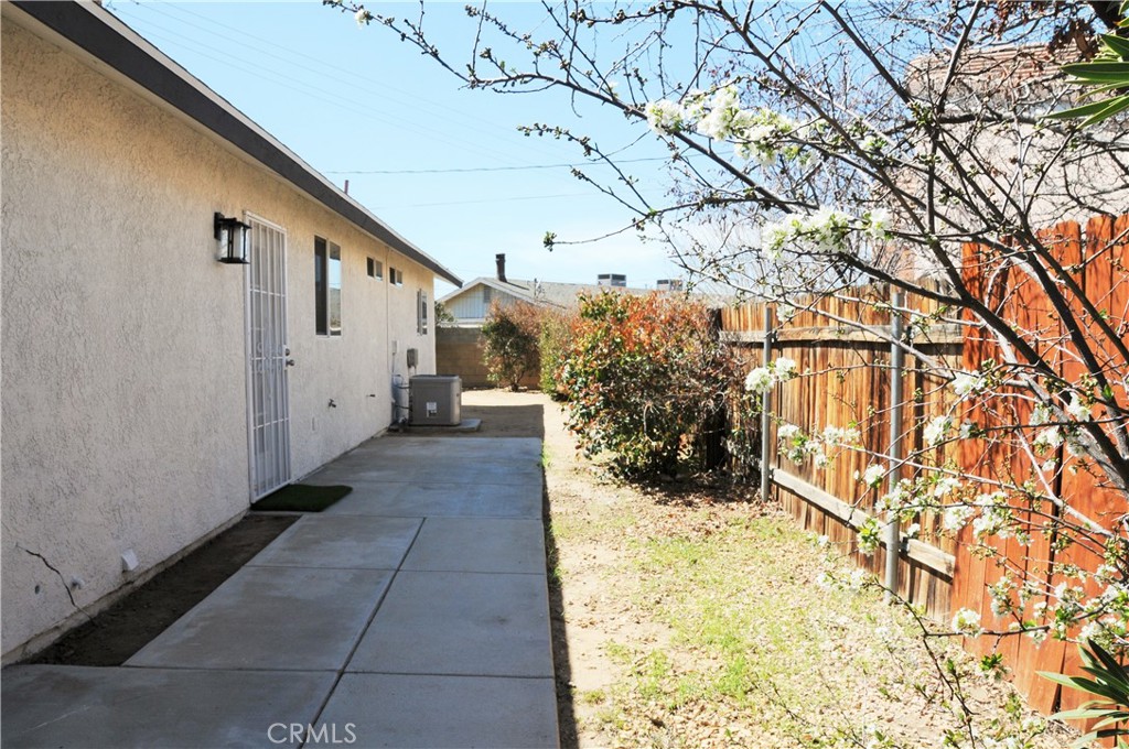 15354 Kiamichi Road Apple Valley, CA 92307 - Photo 18 of 22 a view of entryway with flower plants