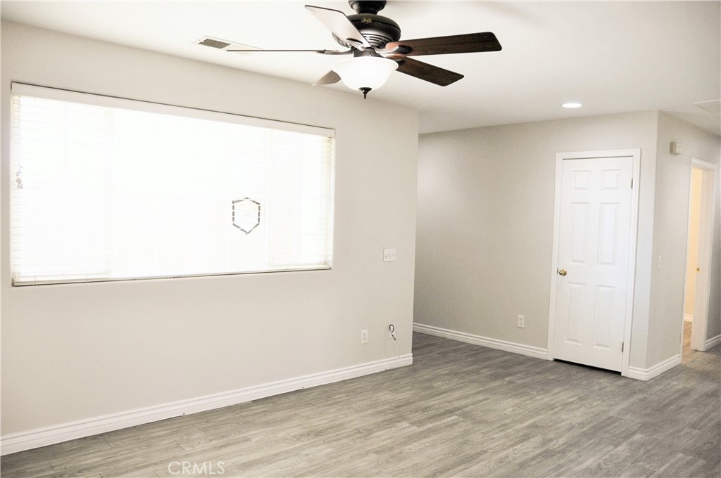 15354 Kiamichi Road Apple Valley, CA 92307 - Photo 4 of 22 a view of a refrigerator in a room