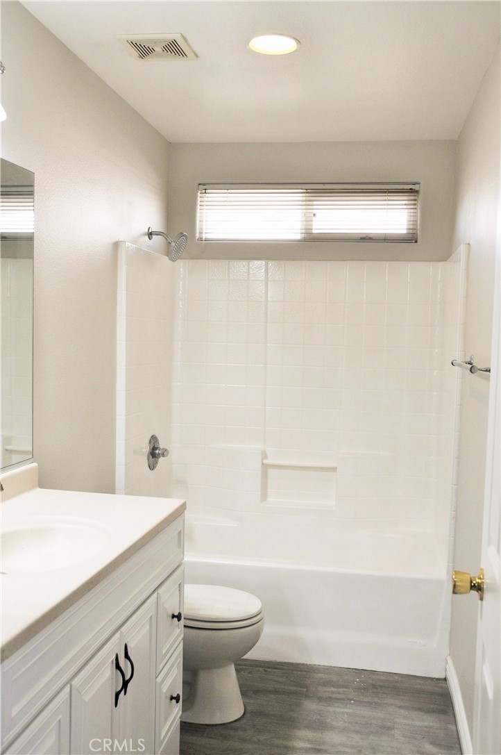15354 Kiamichi Road Apple Valley, CA 92307 - Photo 10 of 22 a bathroom with a sink a toilet and shower