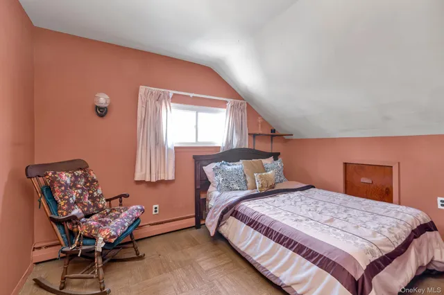 a bedroom with a bed and chair