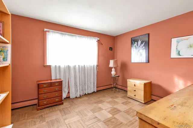 a view of room with window and furniture