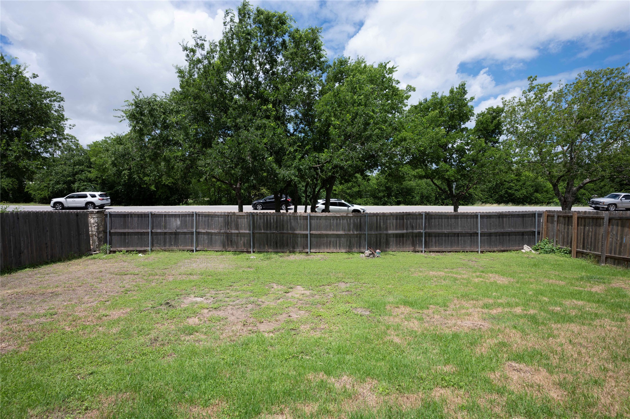 2070 Intrepid Drive Buda, TX 78610 - Photo 26 of 31 Secure yard space with wooden fencing providing separation from the street.