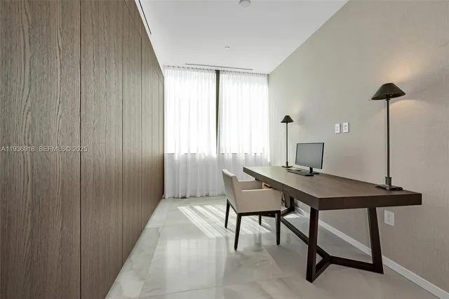 a view of a livingroom with furniture and a window