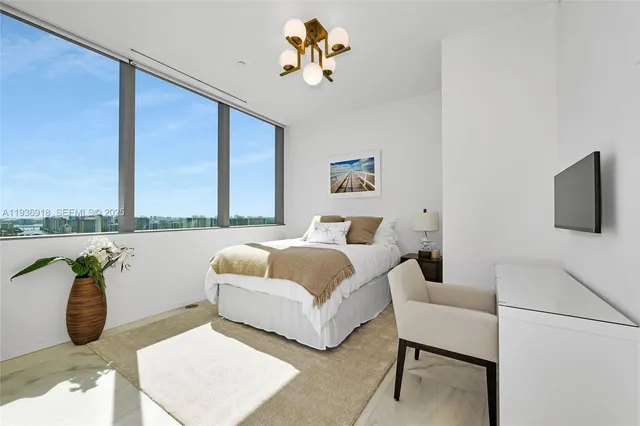 a bedroom with a bed and a couch